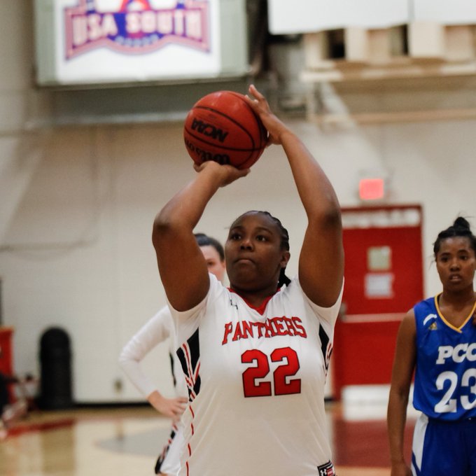 Woman shooting hoops